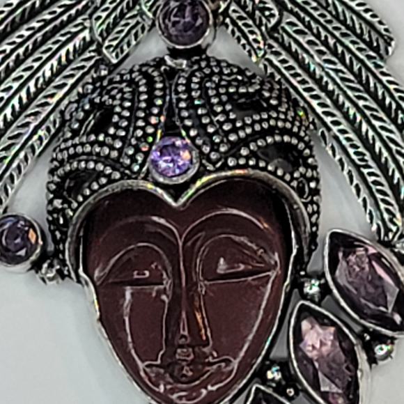 Sterling Silver Pendant with Brown Carved Face, Blue Topaz, and Feather Motif - Picture 7 of 13